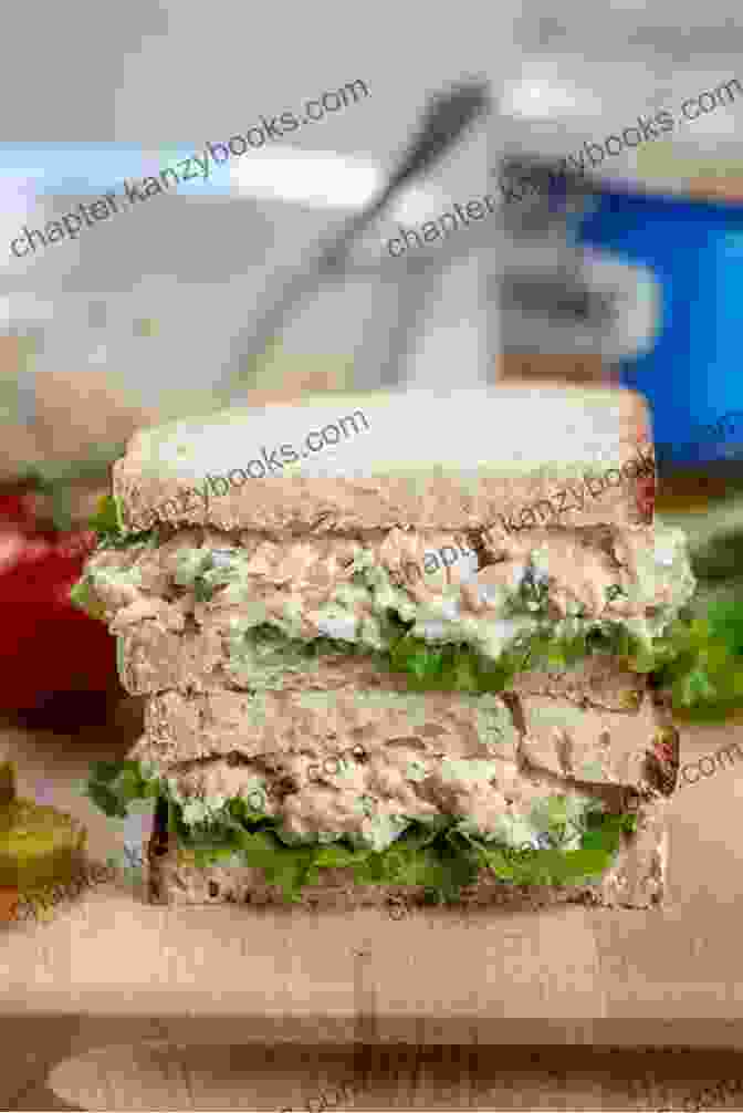 A Photo Of A Classic Chicken Salad Sandwich With Tomato On A Plate Hello 222 Sandwich Salad Recipes: Best Sandwich Salad Cookbook Ever For Beginners Egg Salad Recipes Chicken Breast Recipes Tuna Salad Cookbook Crab Salad Recipes Cucumber Salad Recipe 1